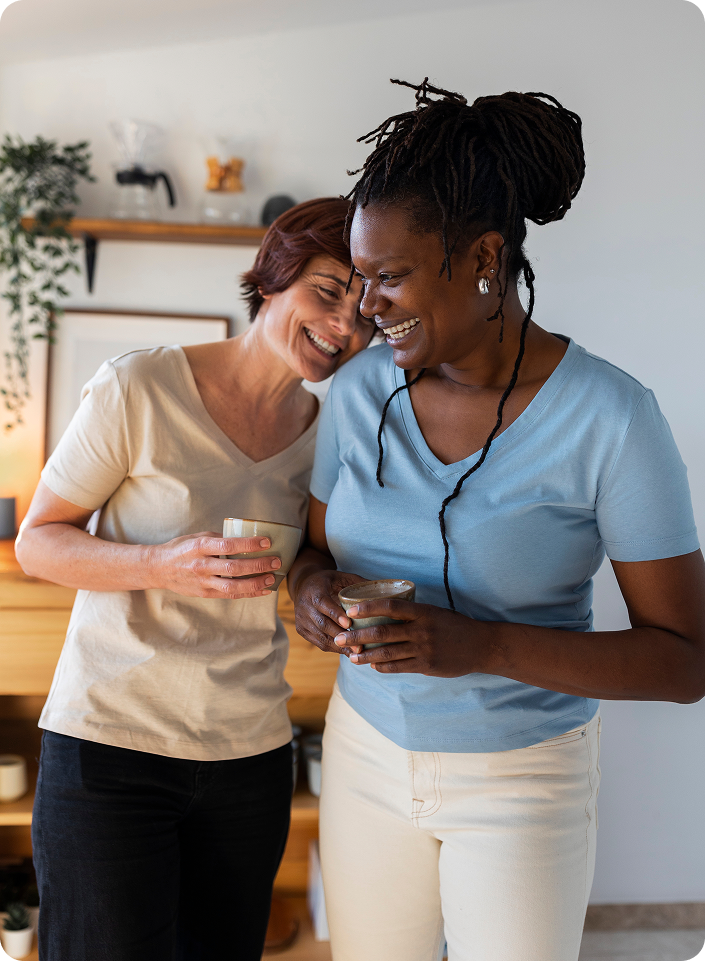 front-view-lesbian-couple-with-coffee-cups (1)